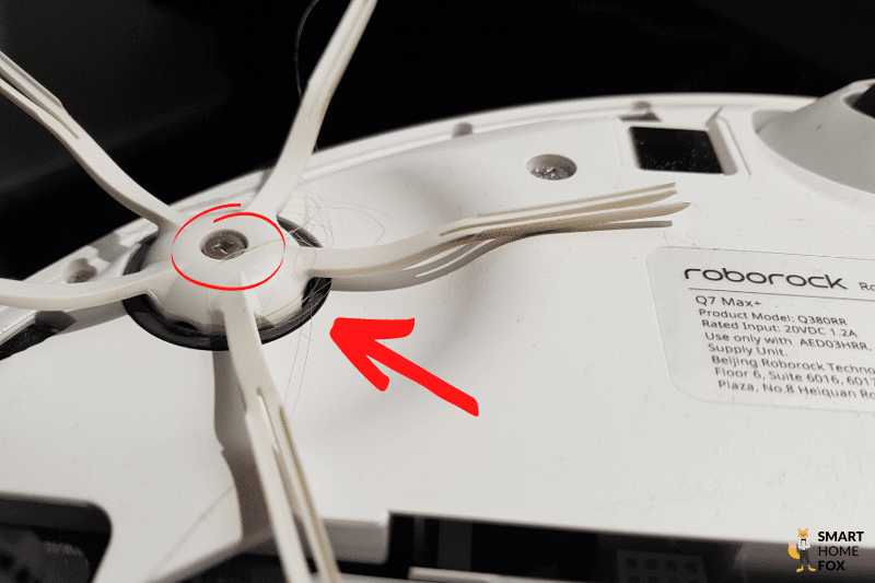 Hair wrapped around the side brush of the Roborock Q7 Max can be seen in the close-up view.